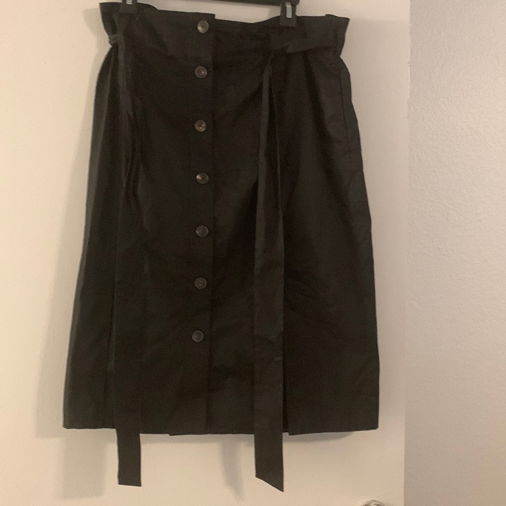 Kate Spade. Never worn. Black mid length skirt with tie.